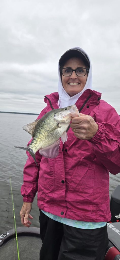 Angler holding a crappie caught during a guided fishing trip on Rend Lake