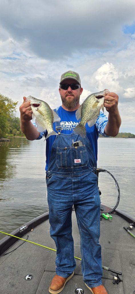 Rippertail Lures owner holding two large crappie caught during a guided fishing trip on Rend Lake