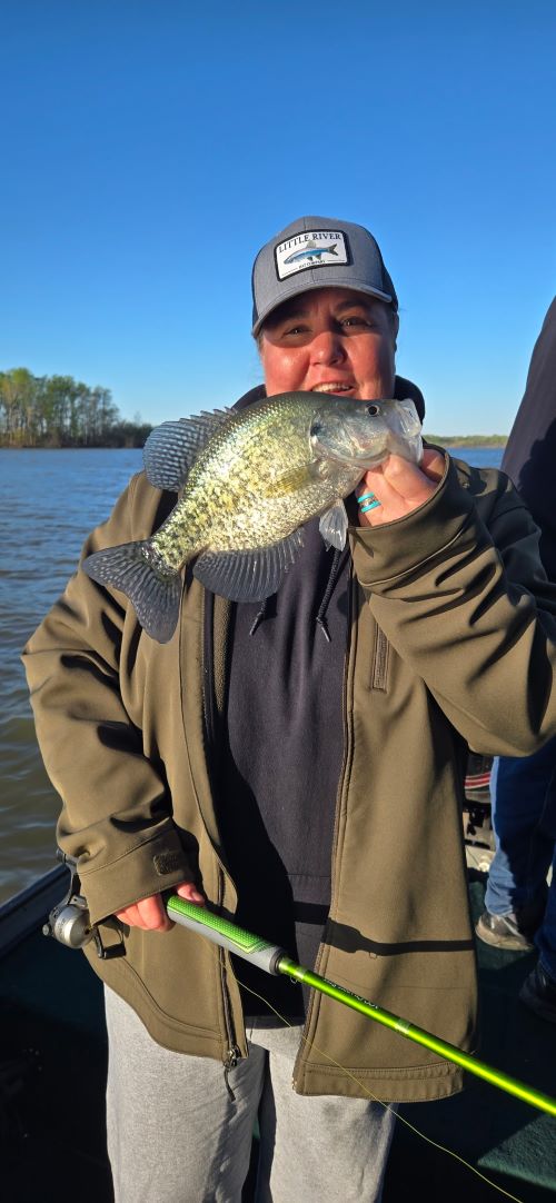 woman customer enjoying a guided crappie fishing trip on Rend Lake