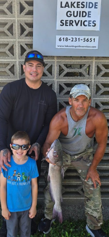 Rend Lake fishing guide Jeff with father & son holding a bonus catfish caught during a crappie fishing trip