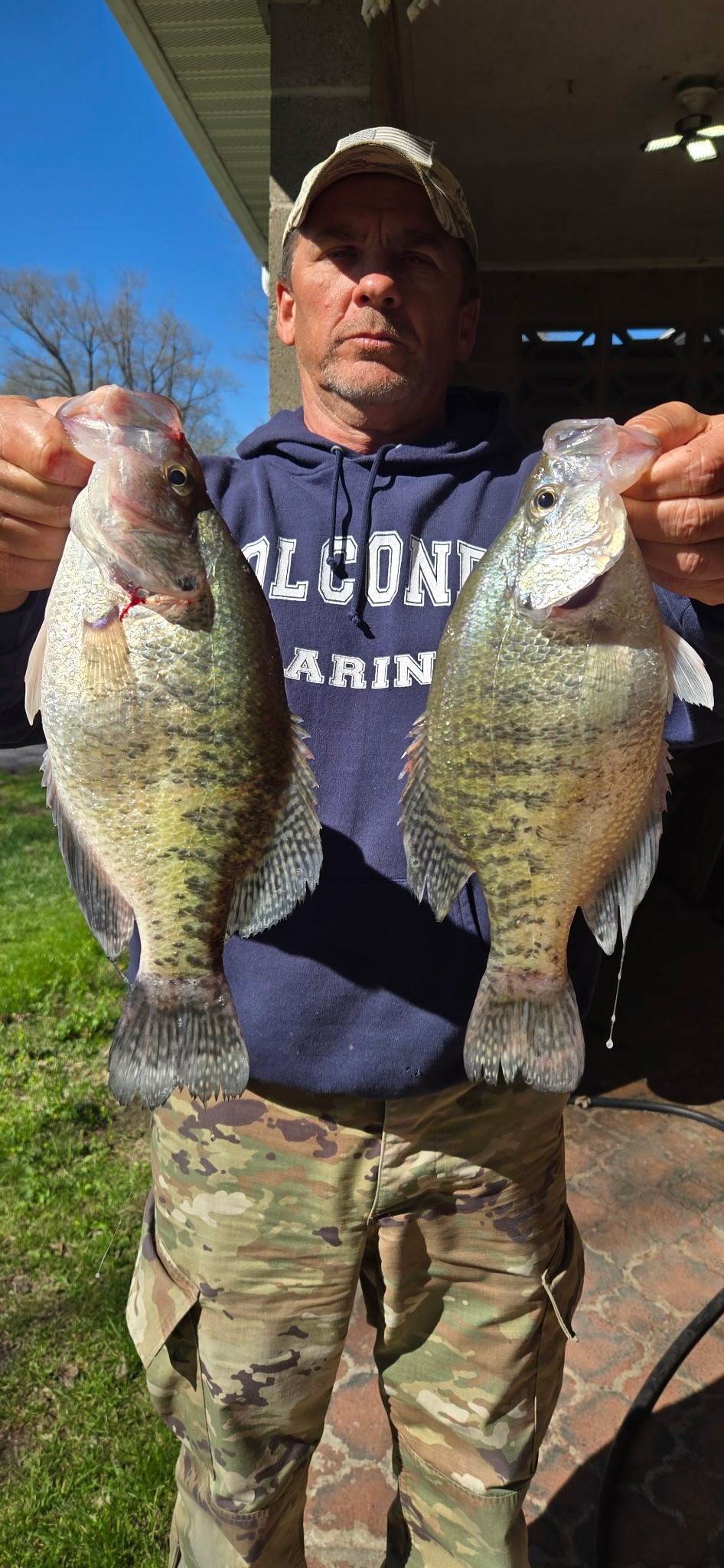 Jeff holding two large crappie caught during a guided fishing trip on Rend Lake