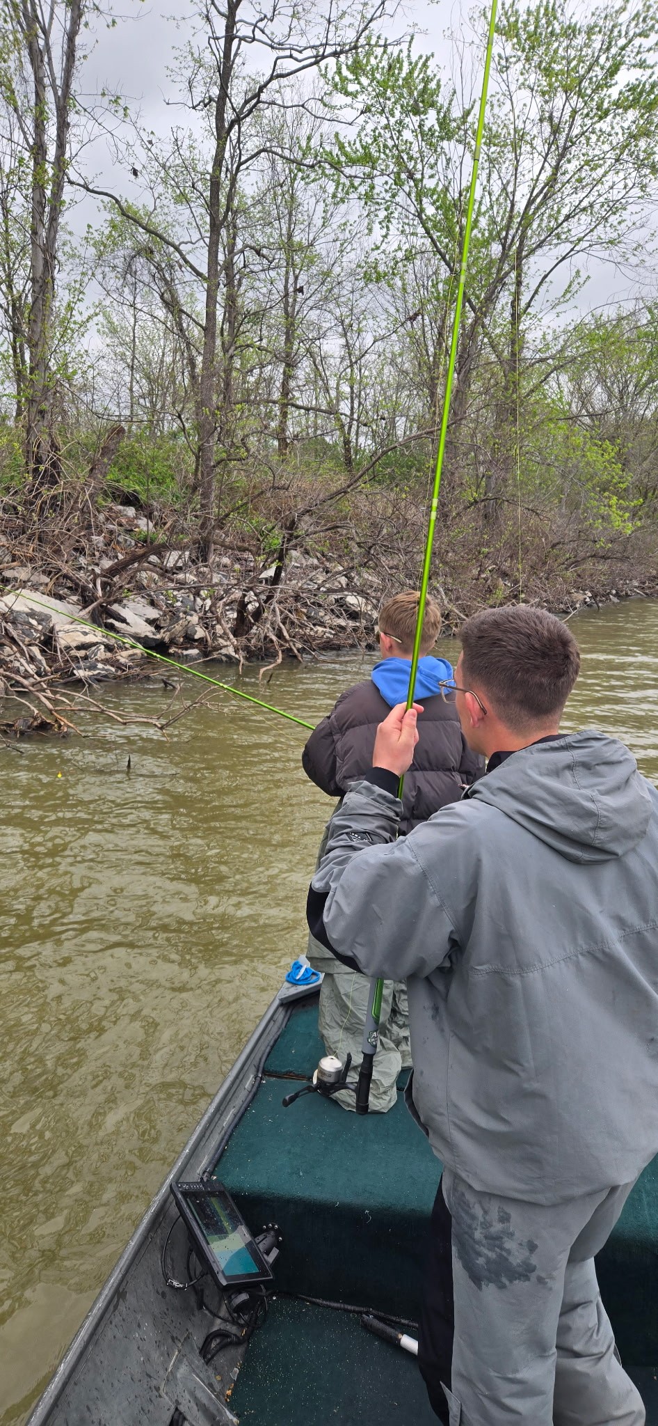 Two boys fishing from a boat on Rend Lake during a guided crappie fishing trip